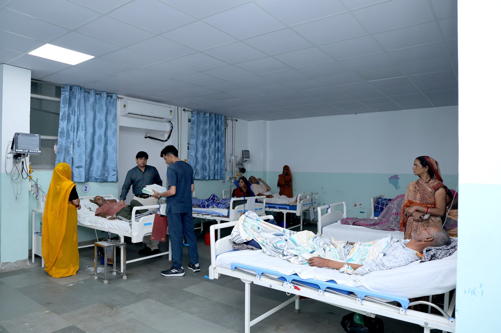 Doctor examining a patient in the general ward.